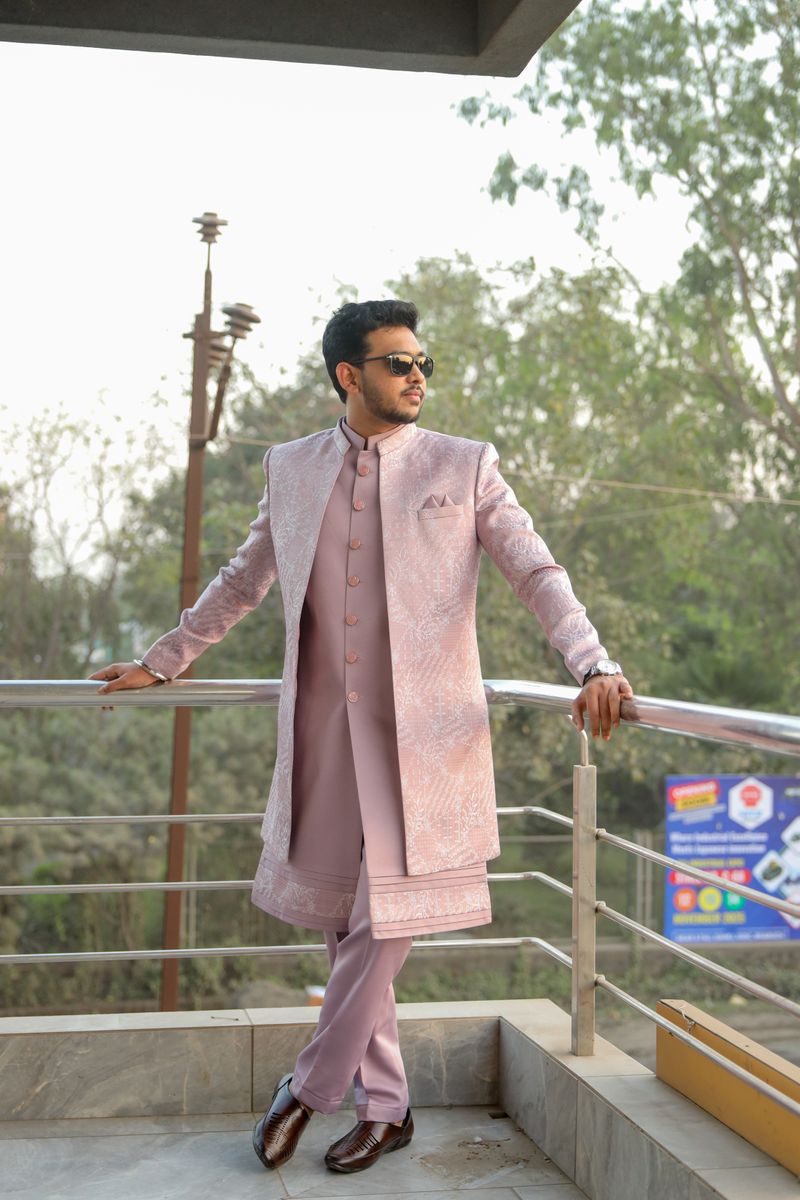 Man in a lilac kurta set standing outdoors